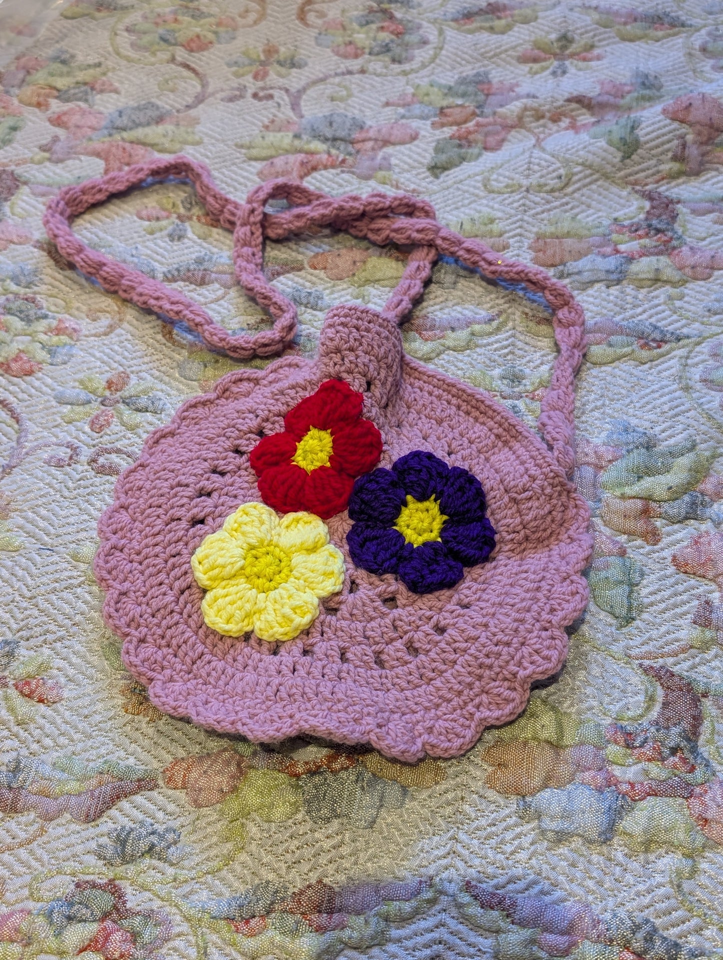 Girls handmade, pink crocheted round shoulder bag .