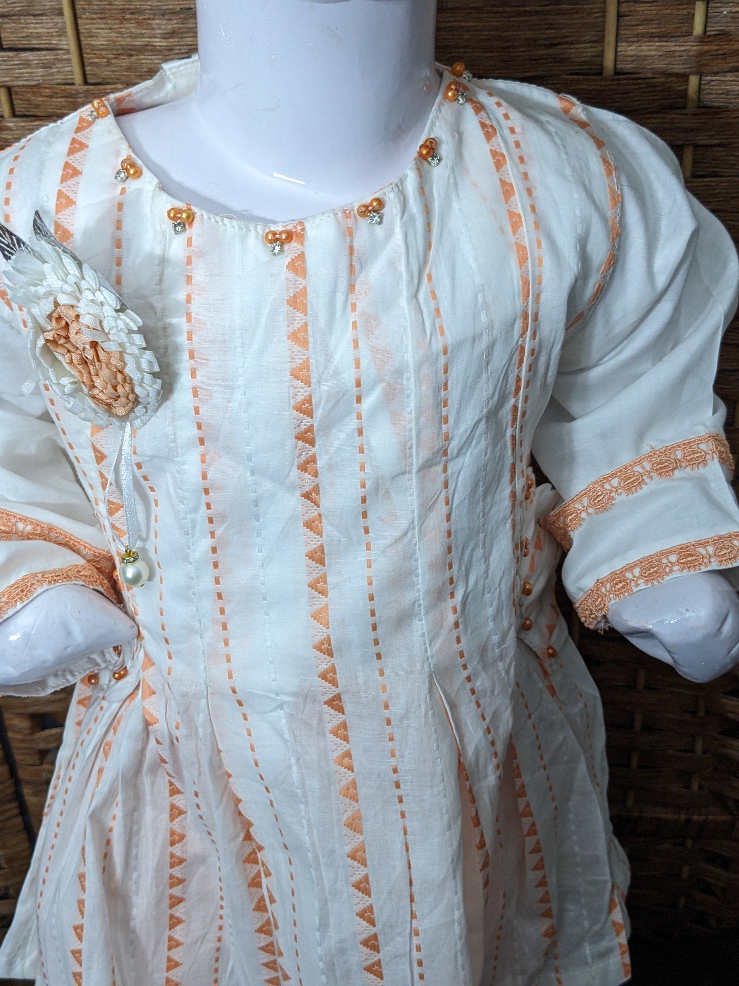 Girls white and orange cotton self print and lacework frock with jersey tights