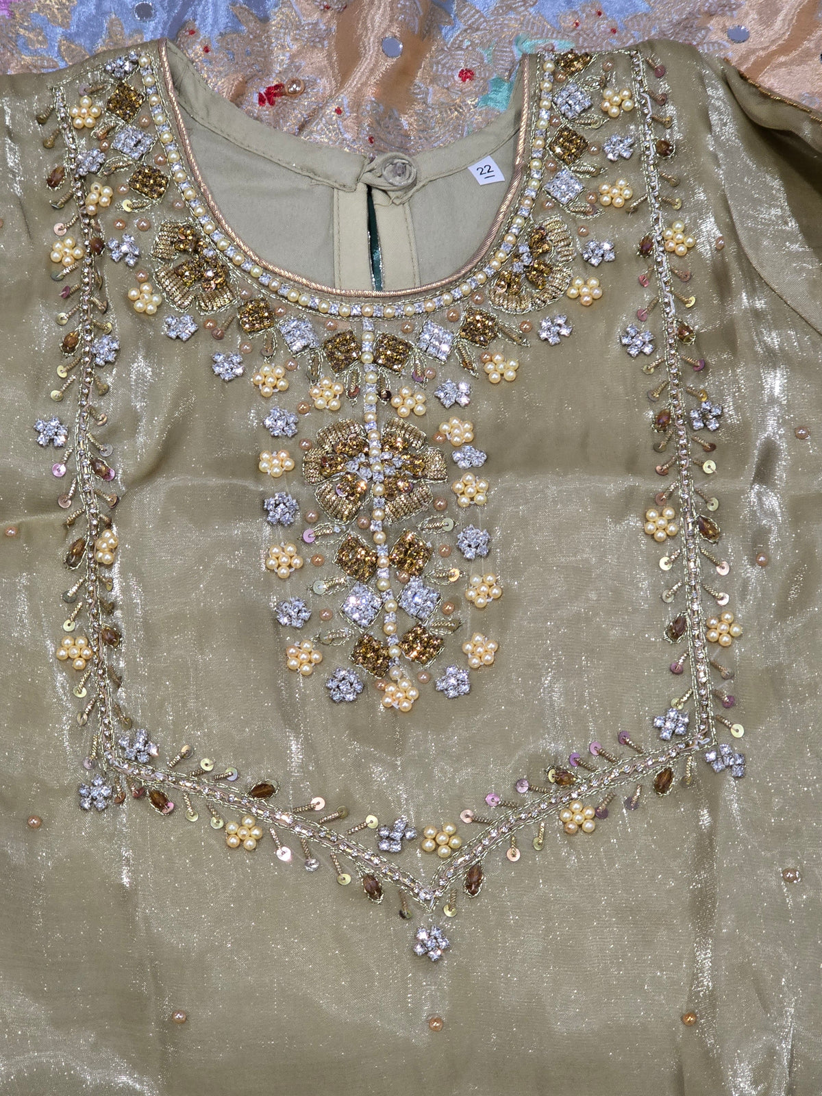 Girls /Olive-gold/ hand-embroidered /silk/ short kurta paired with matching flared gharara and sheer dupatta.