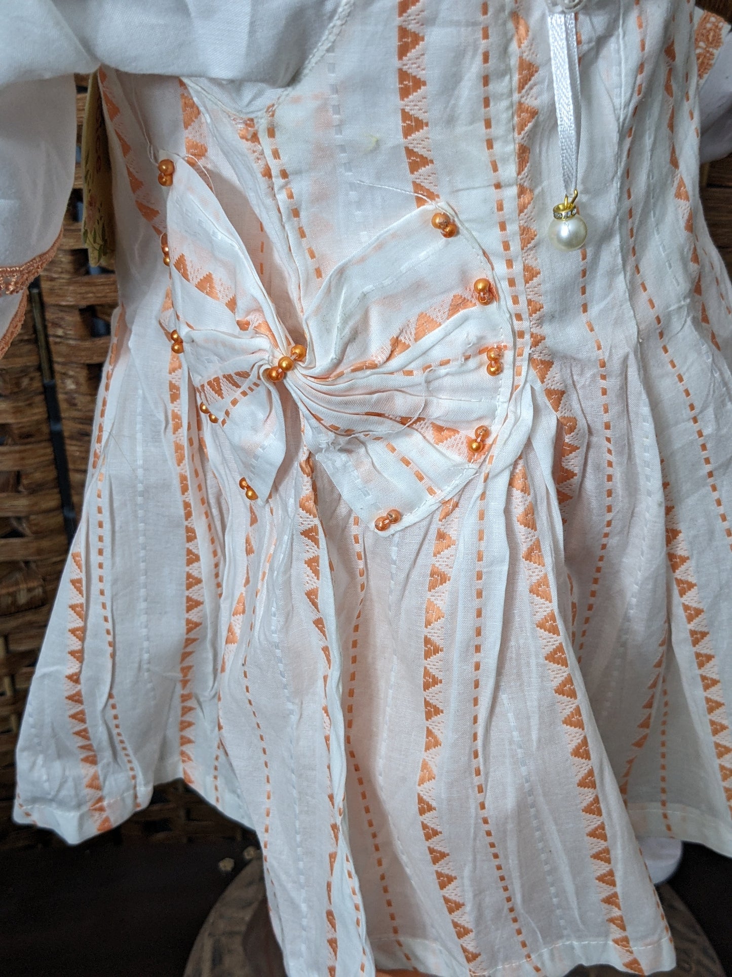 Girls white and orange cotton self print and lacework frock with jersey tights