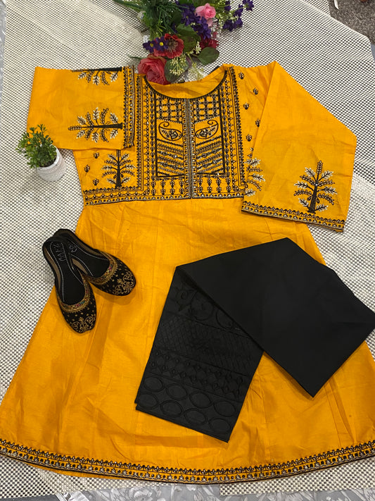 Beautiful yellow embroidered frock with black chicken Kari pyjama