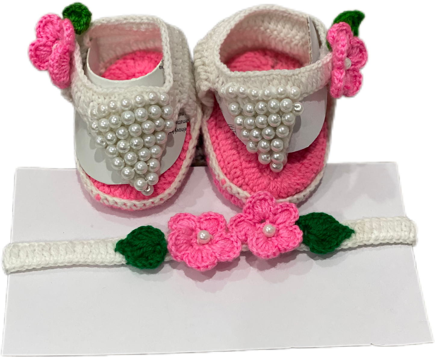 White and pink hand knit footwear with matching headband for baby girl