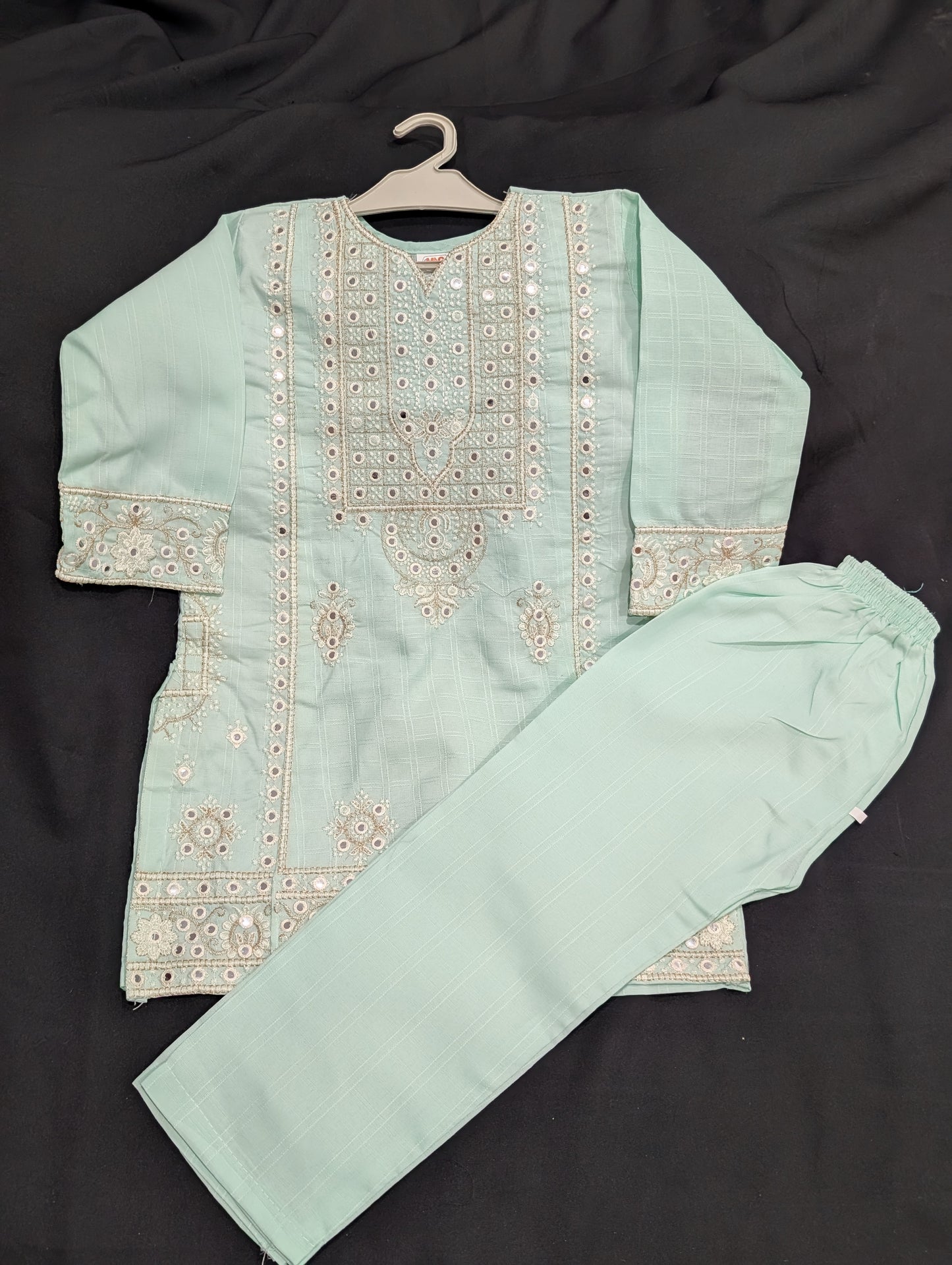 Girls' cotton dress with full mirror work embroidery and matching pants.