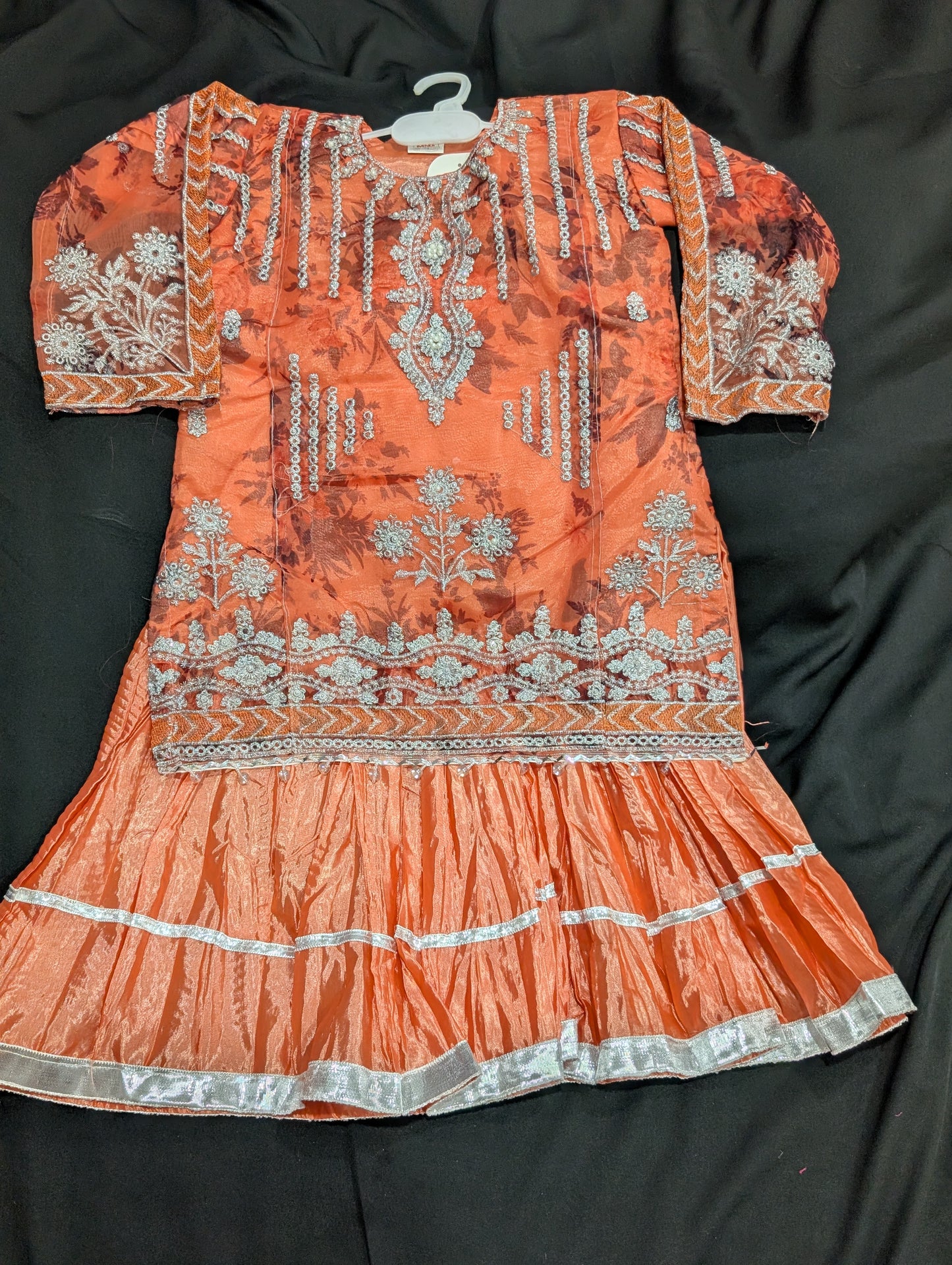 Girls' chiffon shirts featuring embroidery, self-print, and stylish sleeves, paired with a crushed gharara and net dupatta.