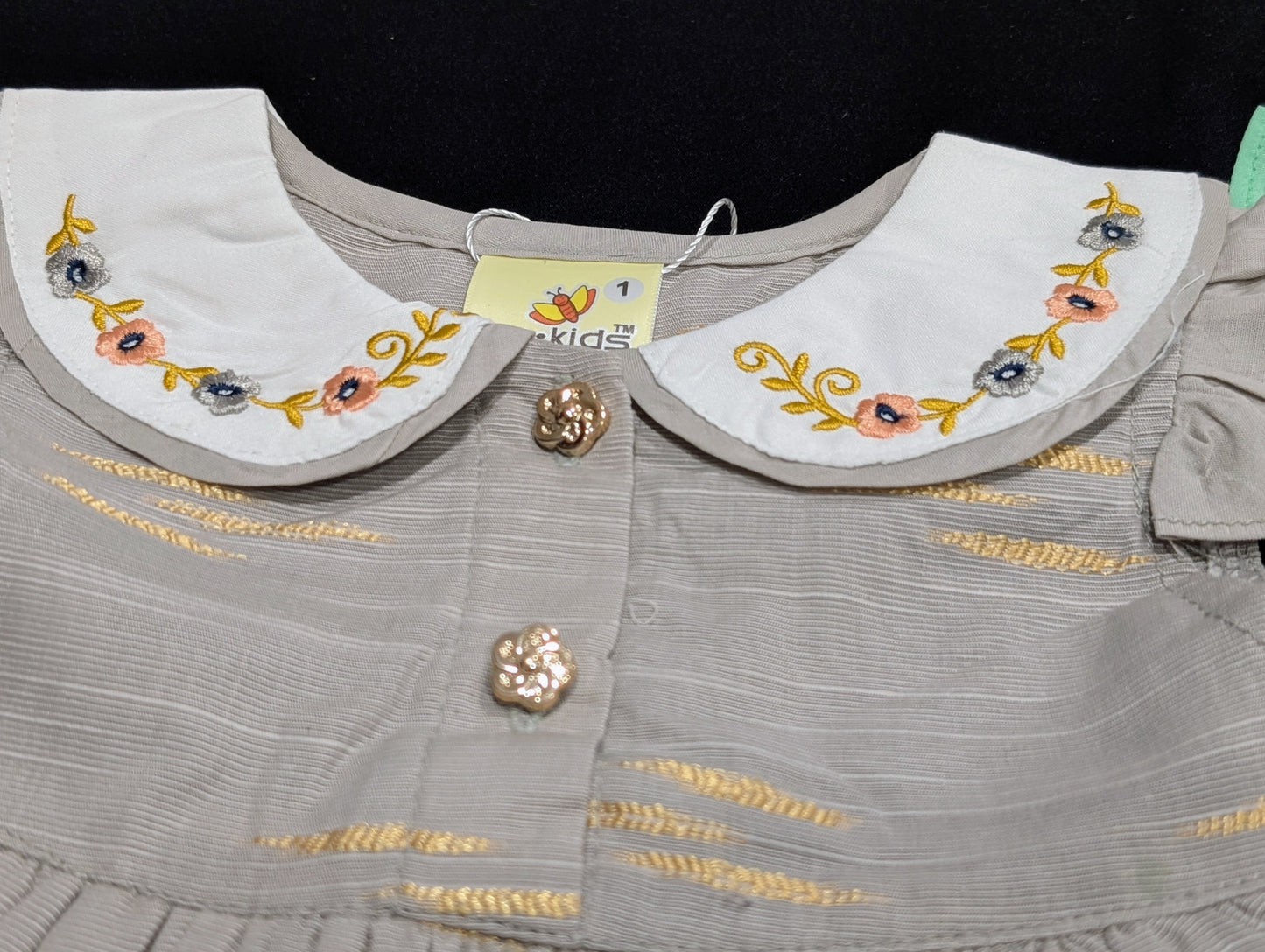 Self-printed and embroidered frocks and pants for baby girls.