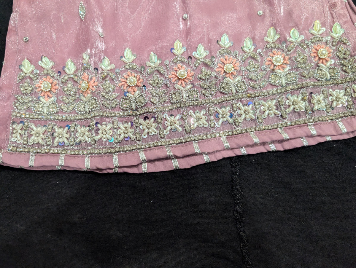 Girls' mauve kurta crafted from soft silk with an inner lining, featuring intricate hand-embellishments. It is paired with a matching gharara made from smooth, premium malai fabric and an ethereal moonlight dupatta.