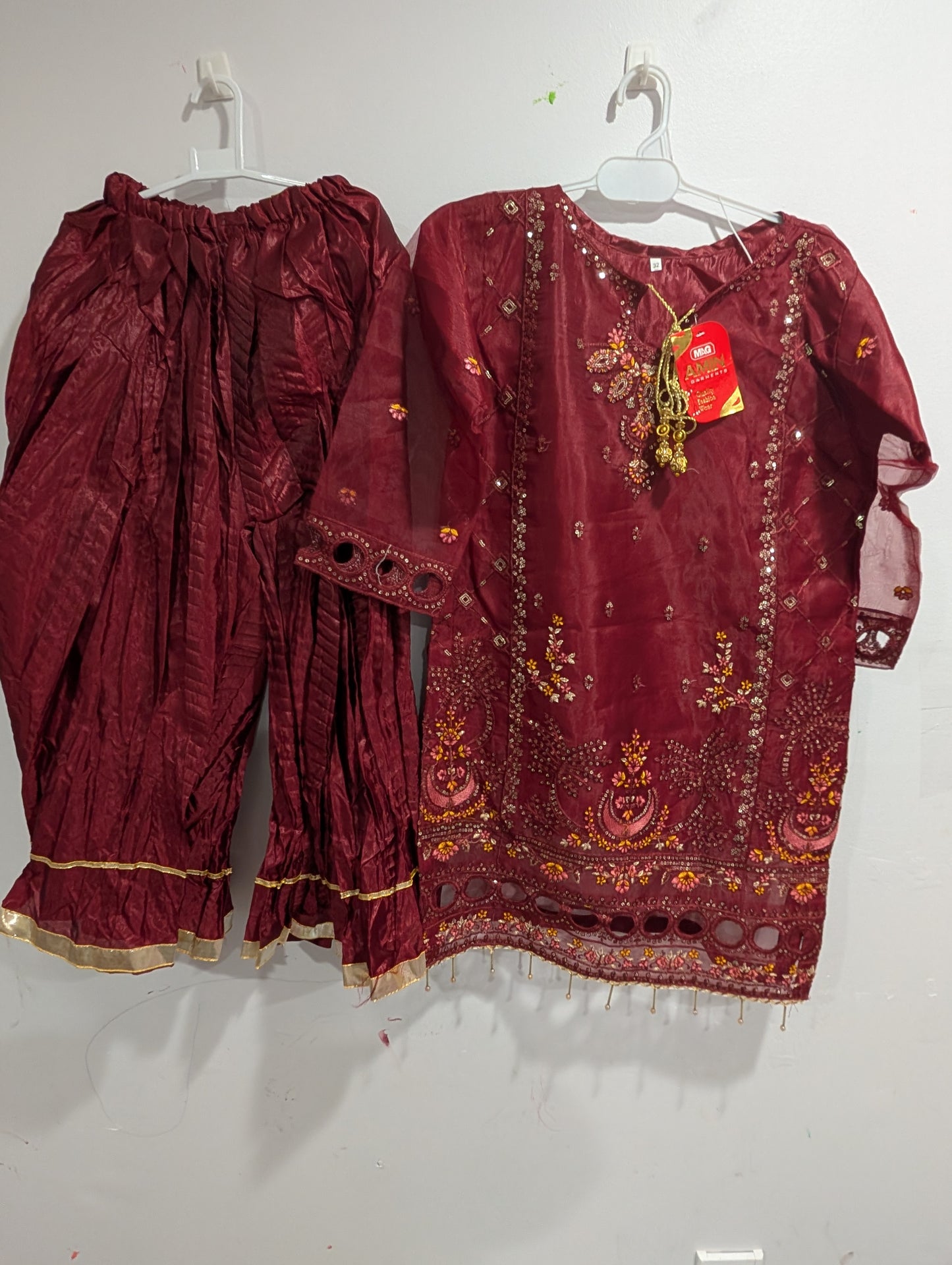 Girls maroon sequence work and embroidered shirt with crush gharara and net dupatta