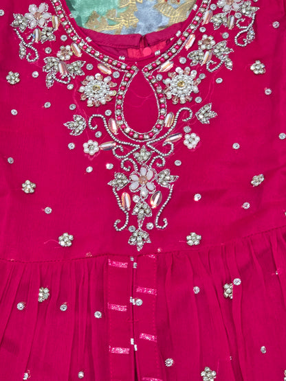 Girls magenta front-open chiffon frock featuring intricate hand embroidery, paired with a matching gharara accented by gotta lace trim and a coordinating chiffon dupatta.