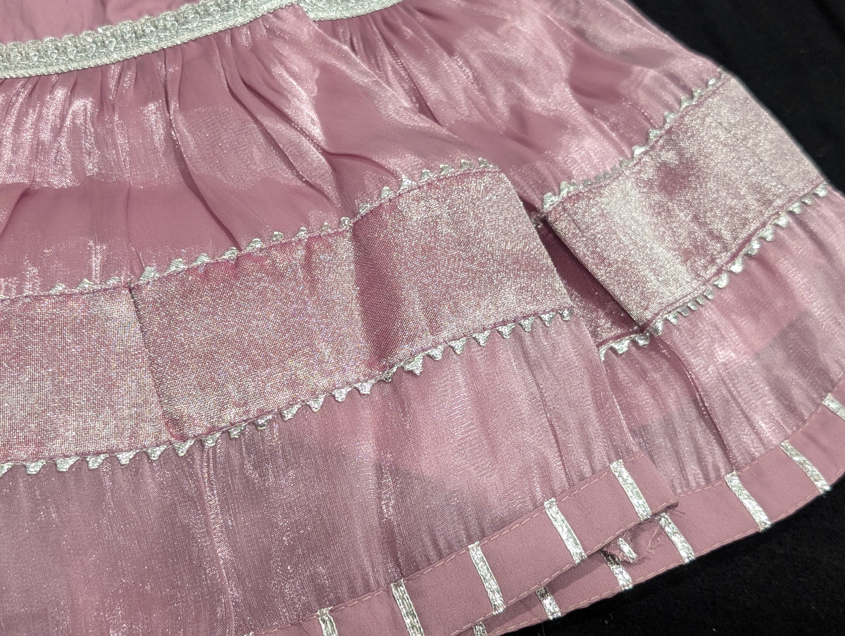 Girls' mauve kurta crafted from soft silk with an inner lining, featuring intricate hand-embellishments. It is paired with a matching gharara made from smooth, premium malai fabric and an ethereal moonlight dupatta.