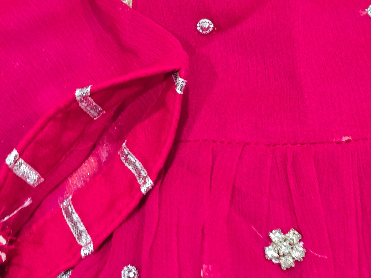 Girls magenta front-open chiffon frock featuring intricate hand embroidery, paired with a matching gharara accented by gotta lace trim and a coordinating chiffon dupatta.