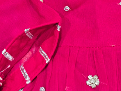 Girls magenta front-open chiffon frock featuring intricate hand embroidery, paired with a matching gharara accented by gotta lace trim and a coordinating chiffon dupatta.
