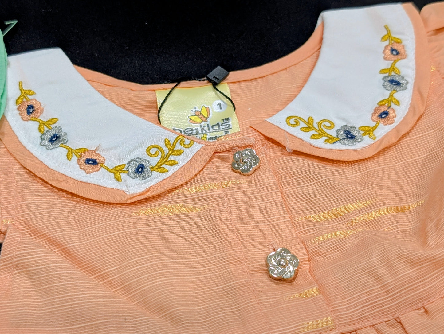 Self-printed and embroidered frocks and pants for baby girls.