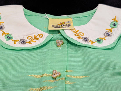 Self-printed and embroidered frocks and pants for baby girls.