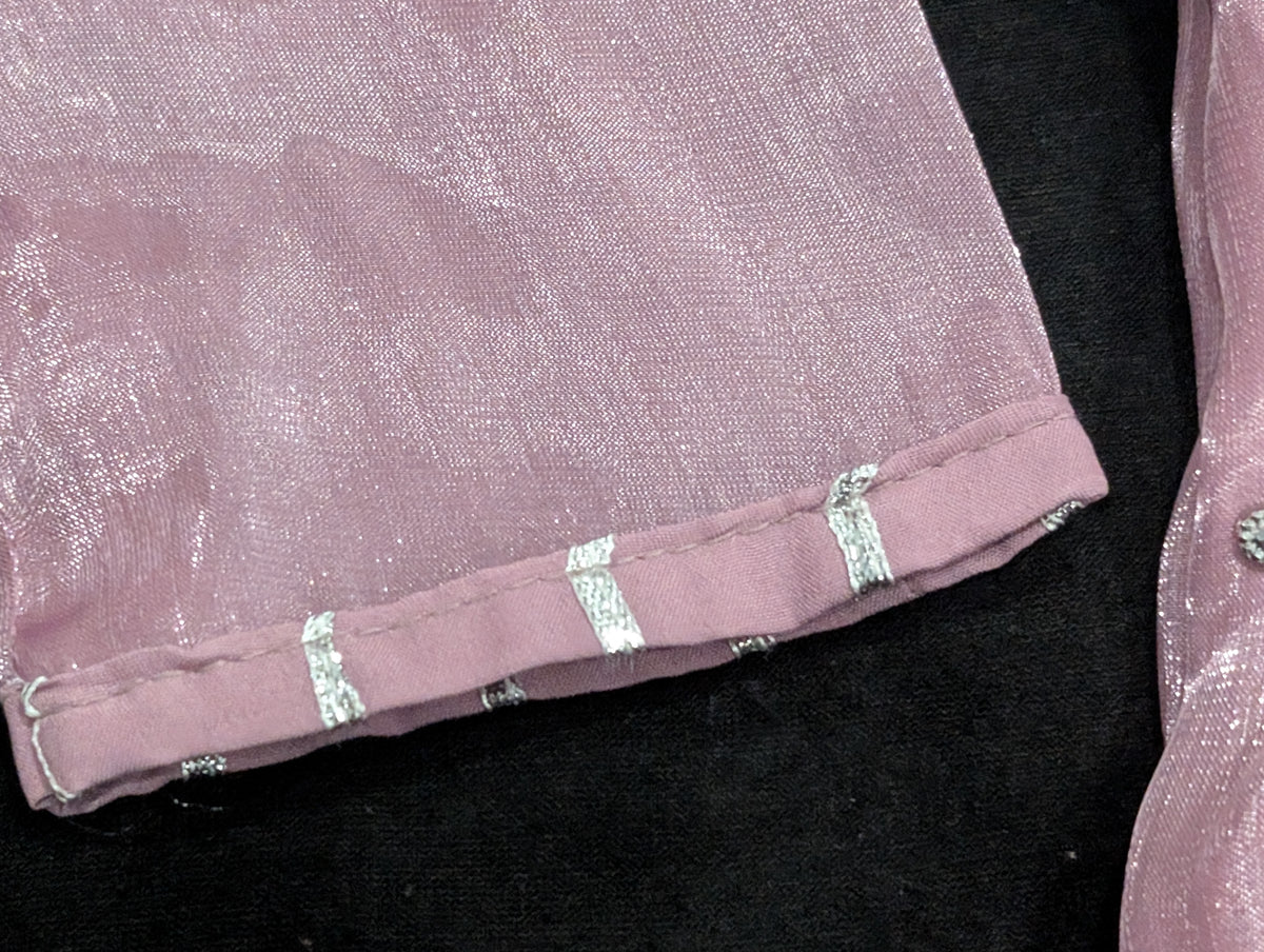Girls' mauve kurta crafted from soft silk with an inner lining, featuring intricate hand-embellishments. It is paired with a matching gharara made from smooth, premium malai fabric and an ethereal moonlight dupatta.