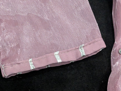 Girls' mauve kurta crafted from soft silk with an inner lining, featuring intricate hand-embellishments. It is paired with a matching gharara made from smooth, premium malai fabric and an ethereal moonlight dupatta.