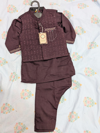 Infant maroon Kurta pyjama set featuring a textured, embroidered waistcoat,