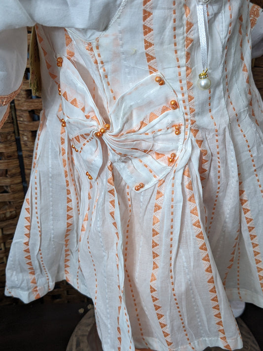 Girls white and orange cotton self print and lacework frock with jersey tights