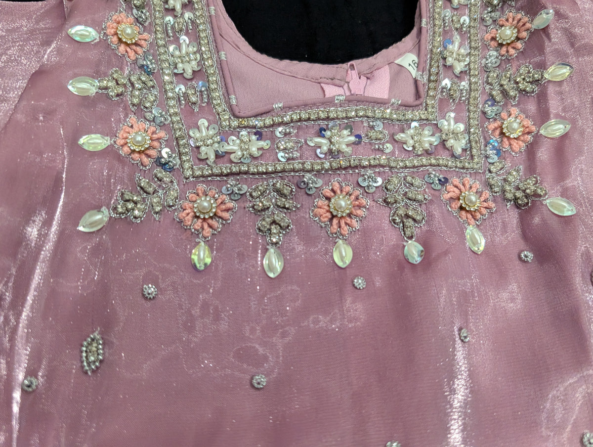 Girls' mauve kurta crafted from soft silk with an inner lining, featuring intricate hand-embellishments. It is paired with a matching gharara made from smooth, premium malai fabric and an ethereal moonlight dupatta.