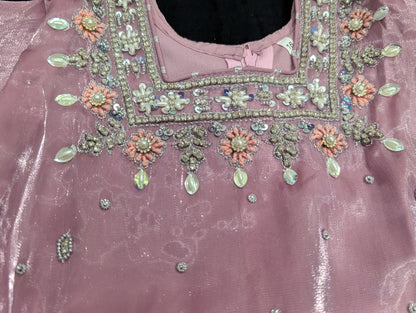 Girls' mauve kurta crafted from soft silk with an inner lining, featuring intricate hand-embellishments. It is paired with a matching gharara made from smooth, premium malai fabric and an ethereal moonlight dupatta.
