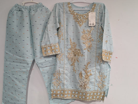 Girls cotton kurta with a matching embroidered pattern and matching pants.
