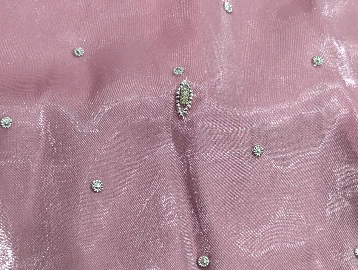 Girls' mauve kurta crafted from soft silk with an inner lining, featuring intricate hand-embellishments. It is paired with a matching gharara made from smooth, premium malai fabric and an ethereal moonlight dupatta.