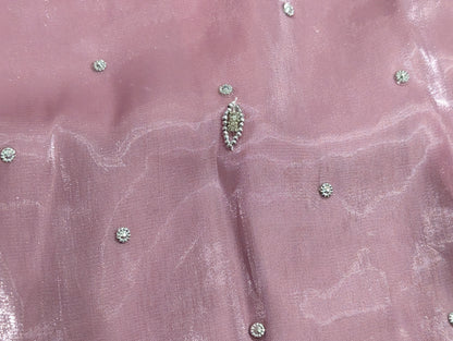 Girls' mauve kurta crafted from soft silk with an inner lining, featuring intricate hand-embellishments. It is paired with a matching gharara made from smooth, premium malai fabric and an ethereal moonlight dupatta.