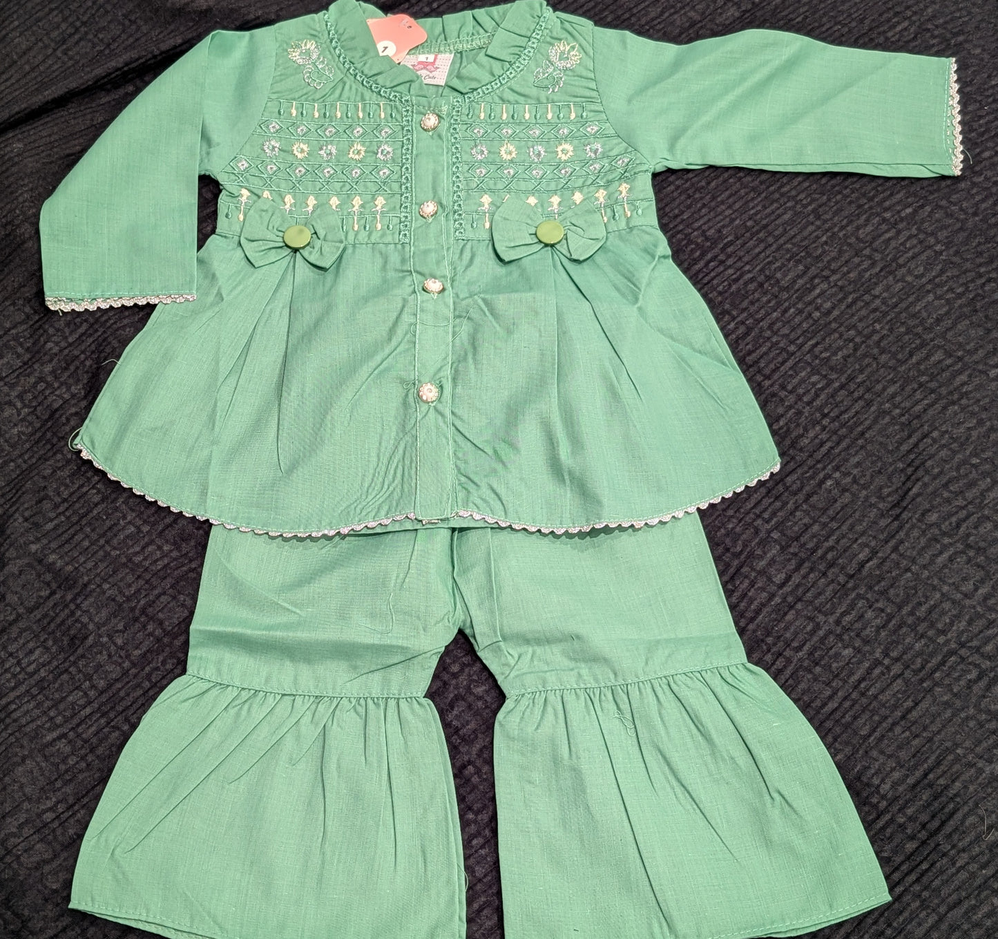 Infant sage green embroidered peplum top and matching ruffled gharara pants.